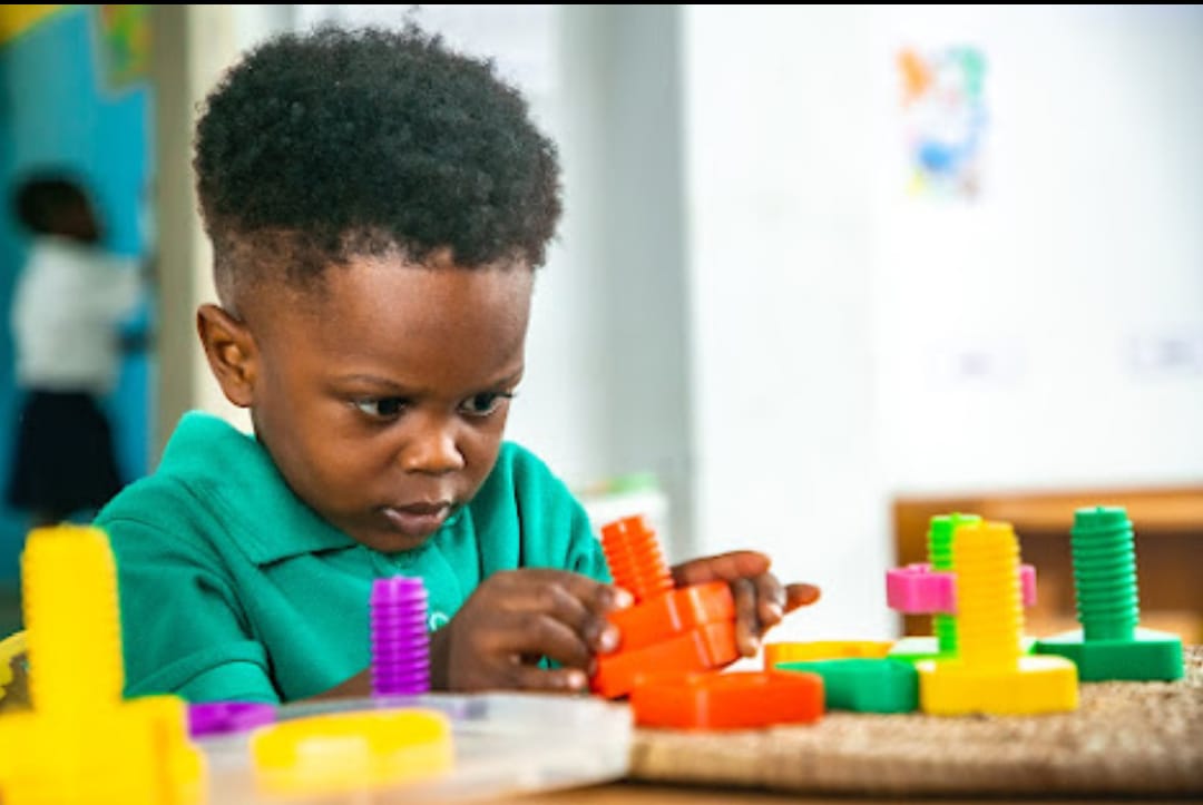 Children learning with Montessori number materials in a Montessori classroom at Ambassadors Bilingual School